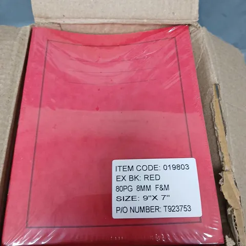 APPROXIMATELY 40 RED EXERCISE BOOKS - 9" X 7"