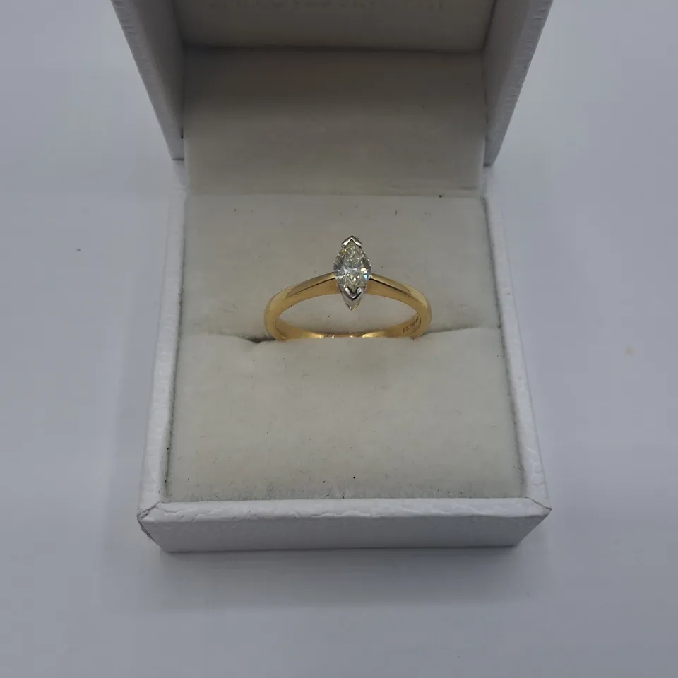 18CT GOLD SOLITAIRE RING SET WITH A NATURAL MARQUISE CUT DIAMOND