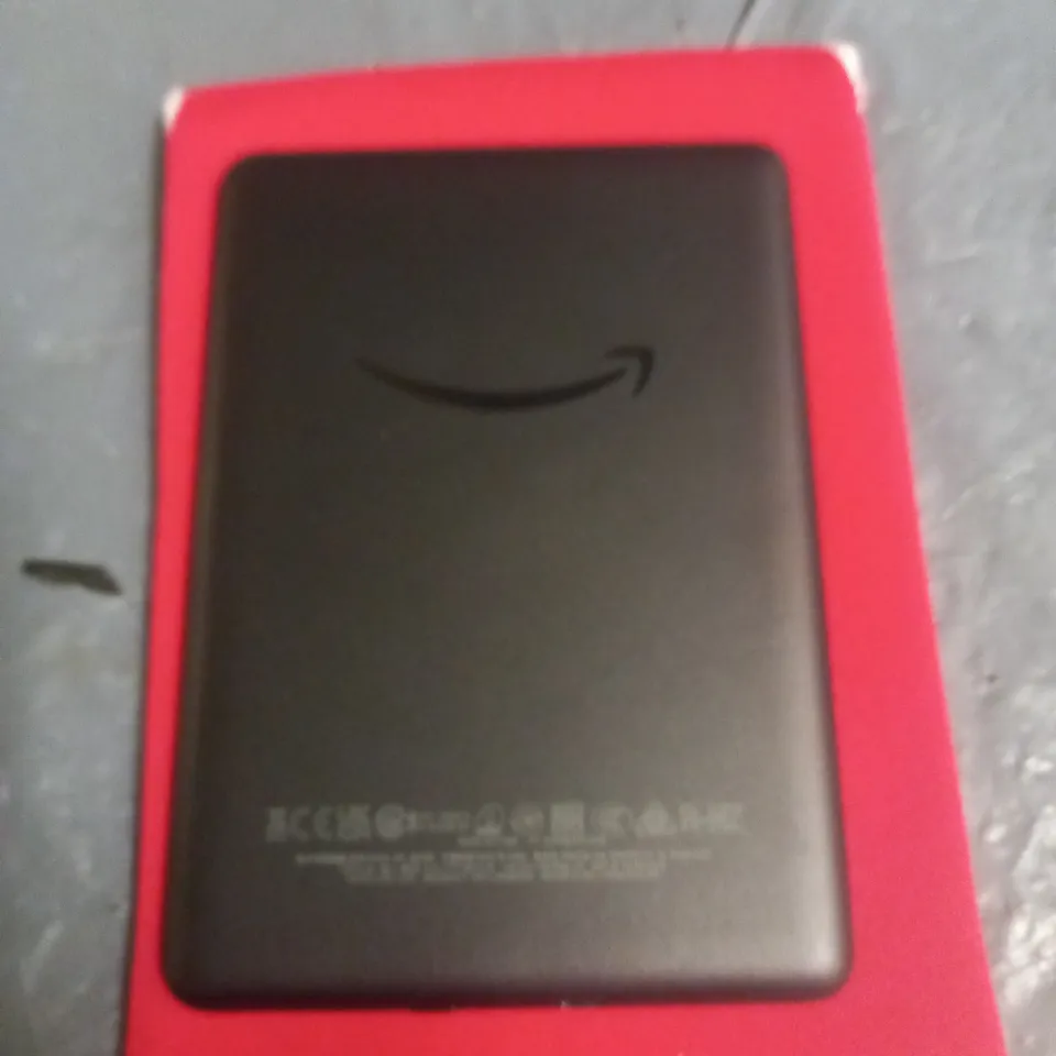 UNBOXED KINDLE JPG29R E-READER IN RED POUCH