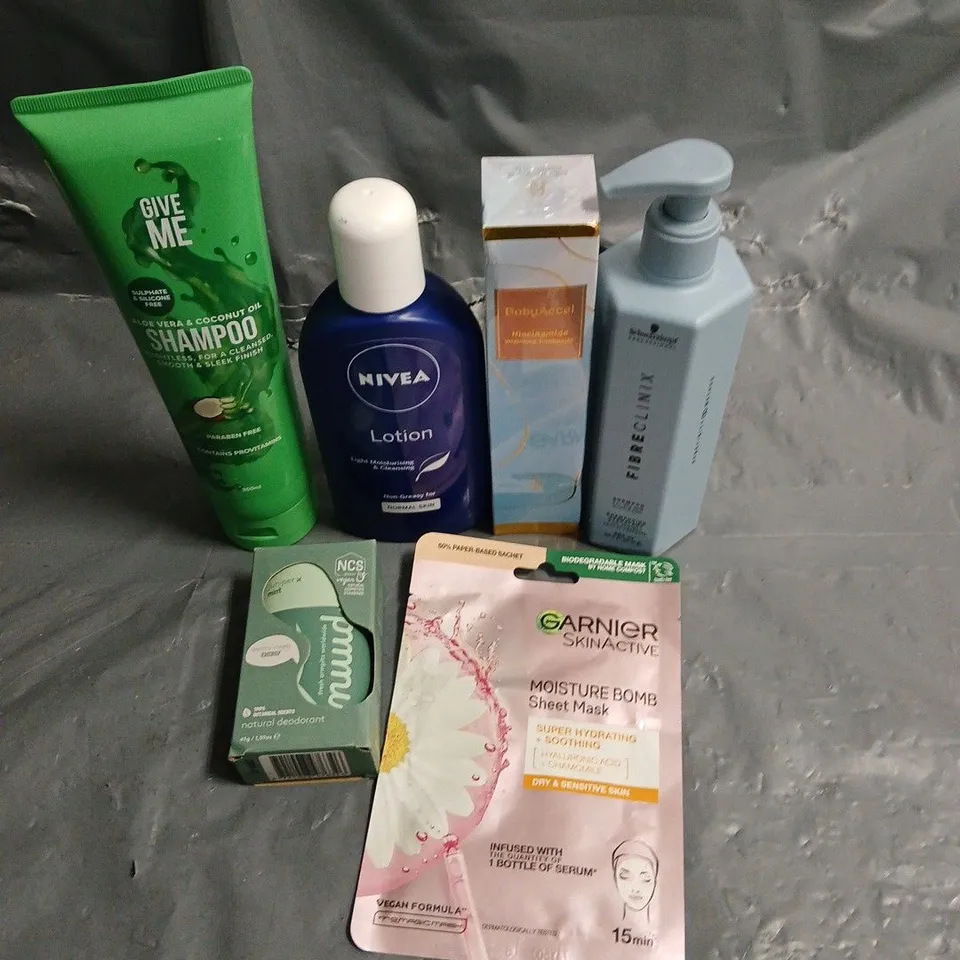 APPROXIMATELY 20 HEALTH AND BEAUTY PRODUCTS TO INCLUDE NIVEA LOTION, GARNIER MOISTURE BOMB MASK AND GIVE ME SHAMPOO