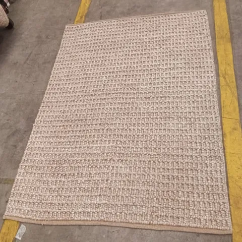 BEIGE WOVEN RUG WITH LOOPED TEXTURE APPROXIMATELY 168 CM X 120 CM