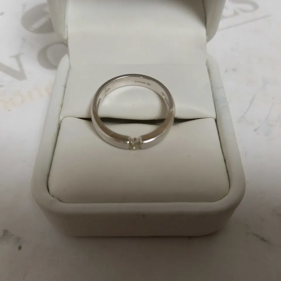 DESIGNER 18CT WHITE GOLD SOLITAIRE RING TENSION SET WITH A DIAMOND