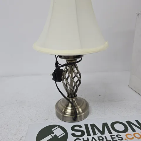 BRASS STYLE TABLE LAMP WITH LATTICE BASE AND CREAM SHADE