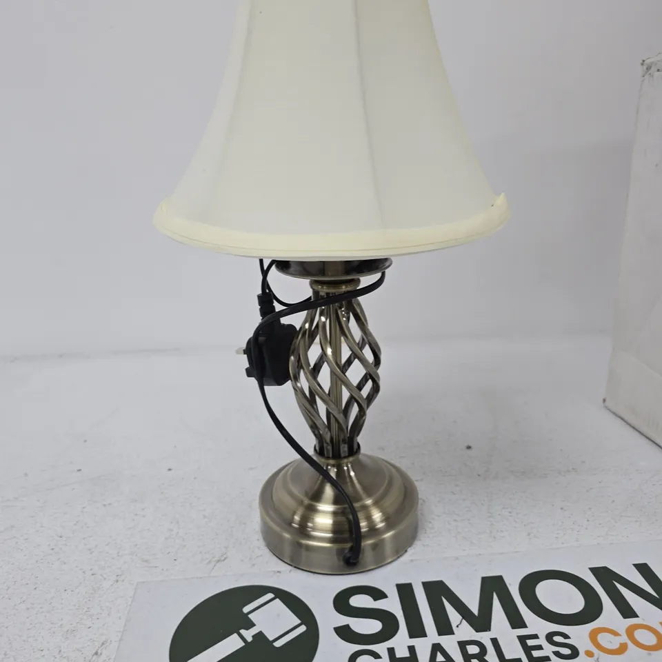 BRASS STYLE TABLE LAMP WITH LATTICE BASE AND CREAM SHADE