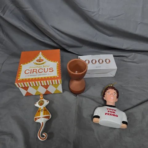 APPROXIMATELY 10 ASSORTED HOUSEHOLD PRODUCTS TO INCLUDE MONKEY ORNAMENT, NAPKIN RINGS, EGG CUP ETC