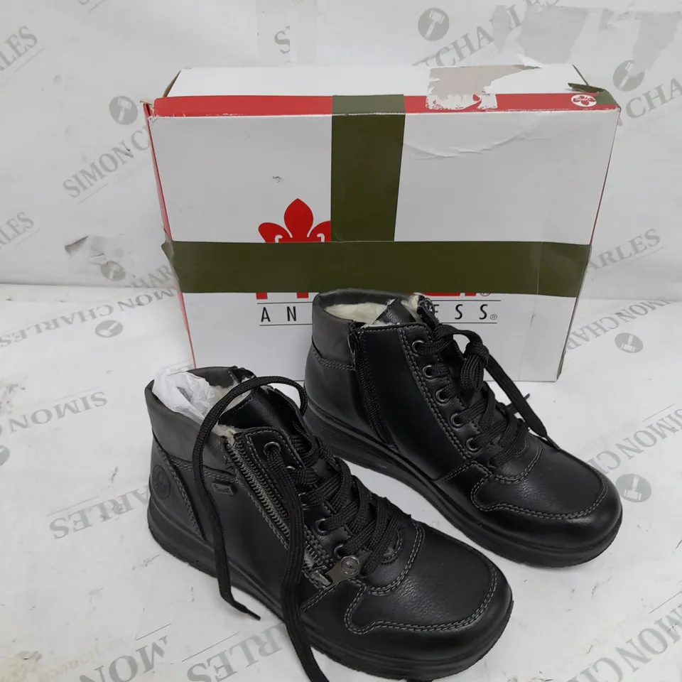BOXED PAIR OF RIEKER WATER RESISTANT BOOTS IN BLACK SIZE 3.5