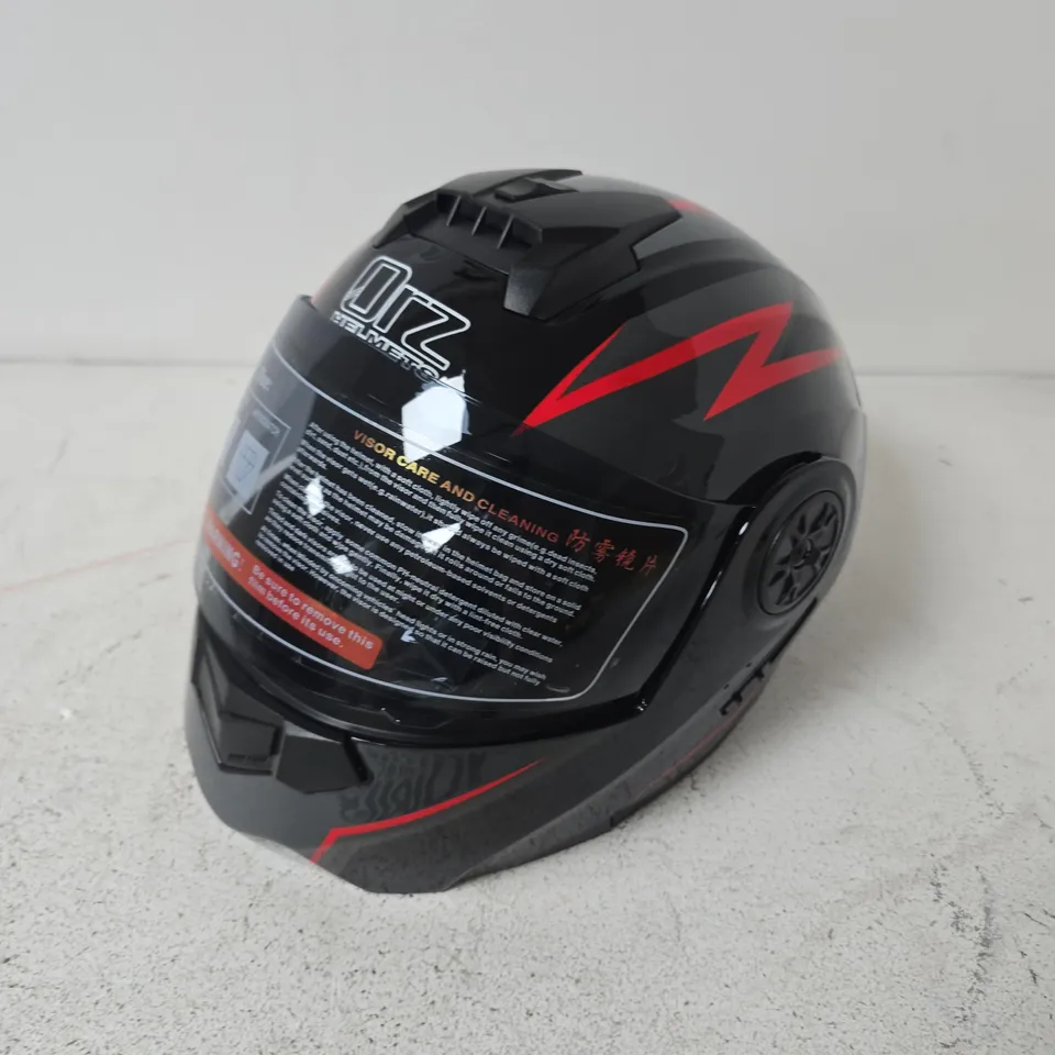 ORZ FULL-FACE MOTORCYCLE HELMET FEATURES A BLACK SHELL WITH VIBRANT RED GRAPHIC ACCENTS