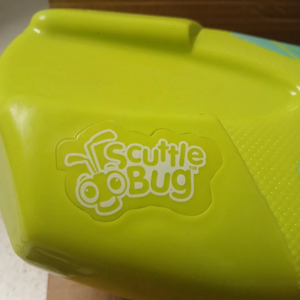 SCUTTLE BUG RIDE-ON TOY – YELLOW WITH TEAL HANDLES AND PURPLE/TEAL GRAPHICS