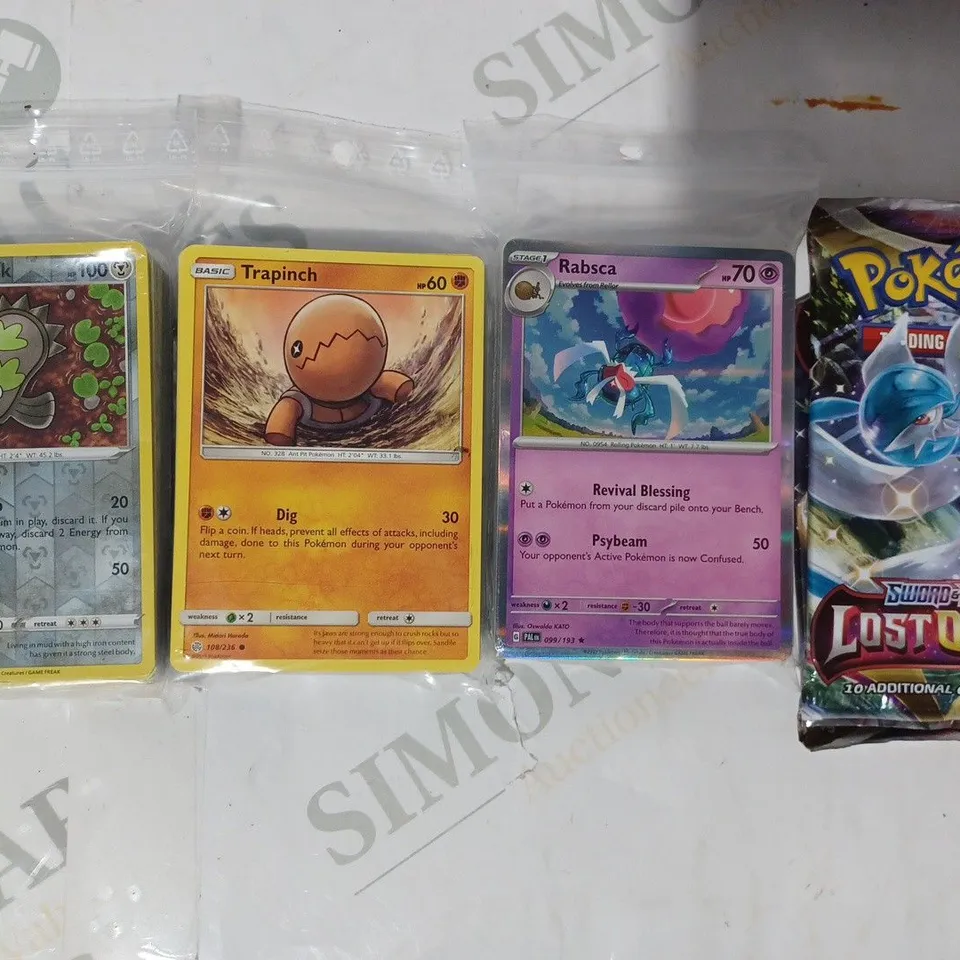 ASSORTMENT OF COLLECTIBLE POKÉMON TRADING CARDS W. 2 BOOSTER PACKS