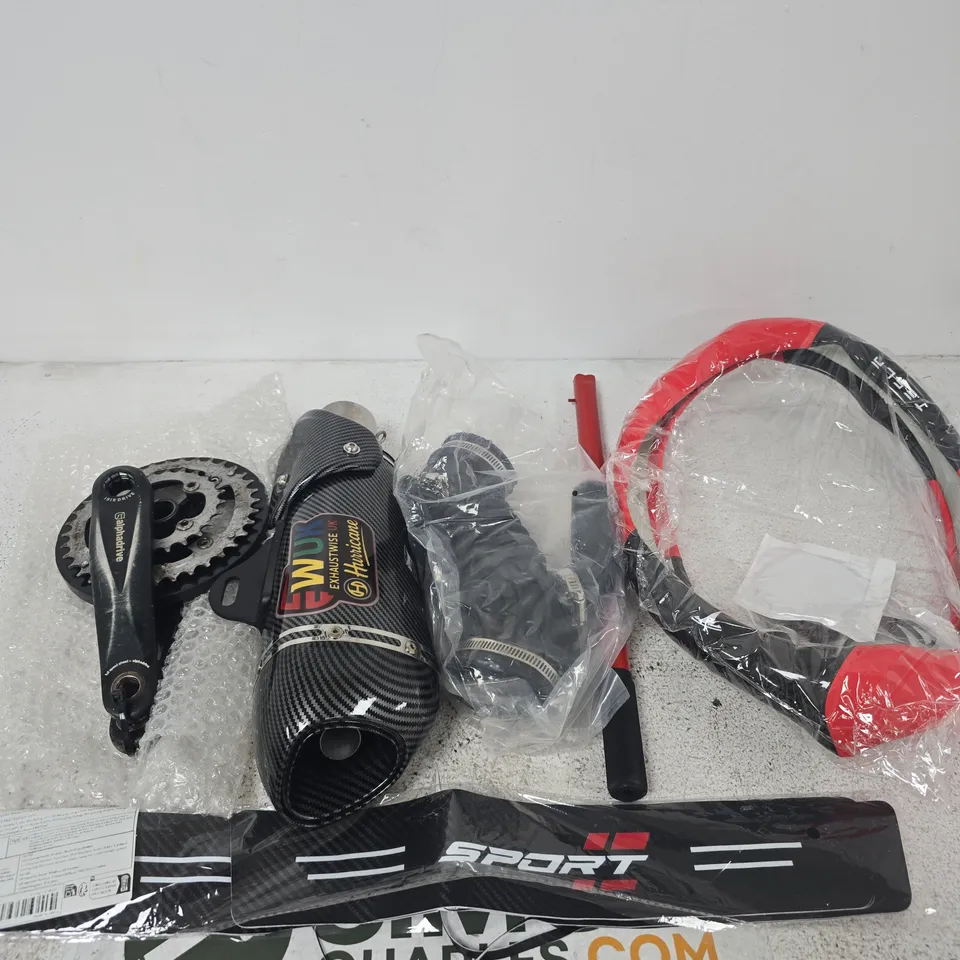 APPROXIMATELY 5 ASSORTED ITEMS INCLUDING ALPHA DRIVE ISIS DRIVE, EW UK EXHAUSTWISE HURRICANE AND A STEERING WHEEL COVER