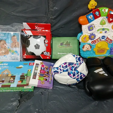 LARGE QUANTITY OF ASSORTED TOYS AND GAMES TO INCLUDE - MAGNETIC BUILDING CUBES, ADIDAS BOXING GLOVES, AND DOUBLE POOL FLOAT ETC. 