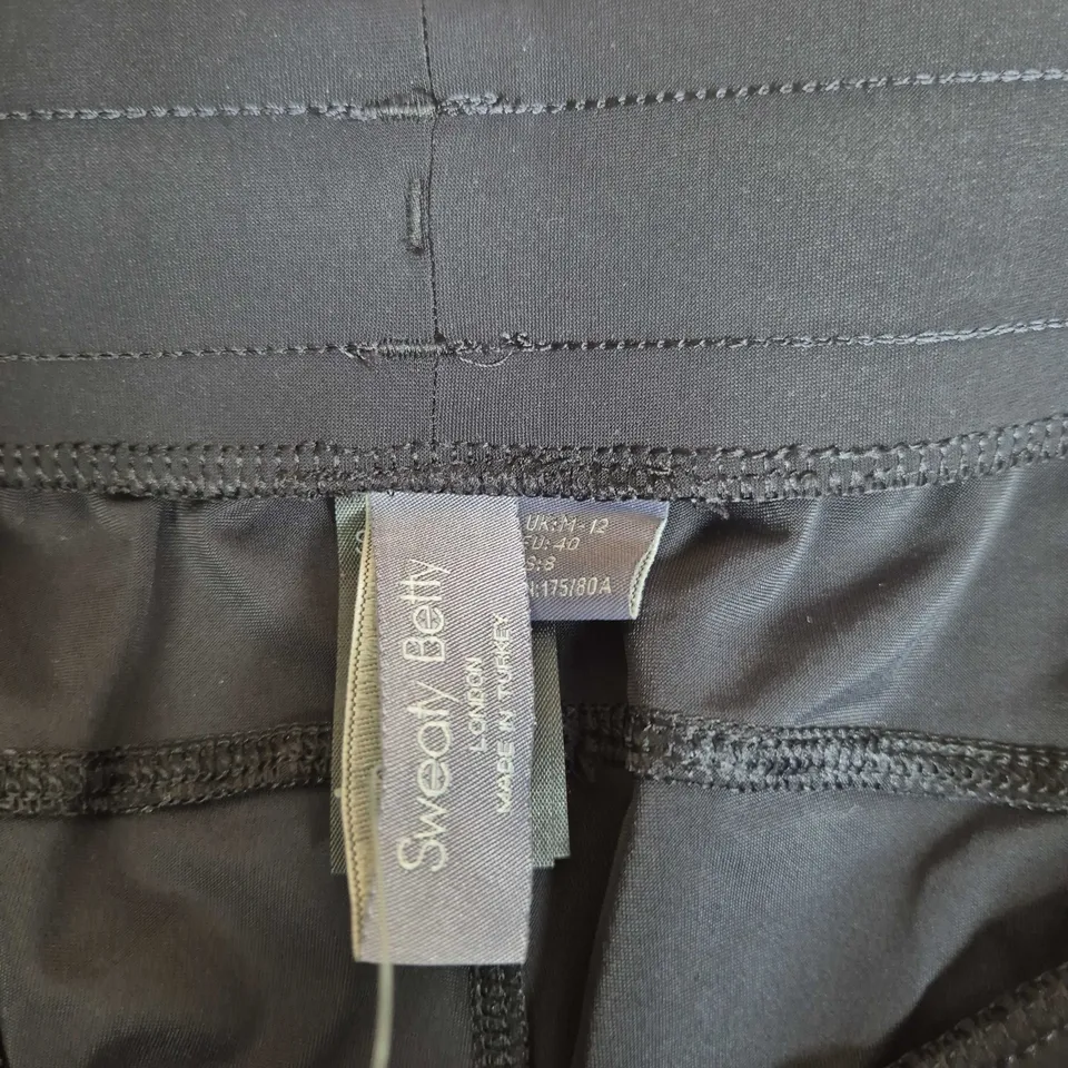 SWEATY BETTY  BLACK SWIM SHORTS – UK 12 (EU 40) WITH DRAWSTRING, TAG ATTACHED