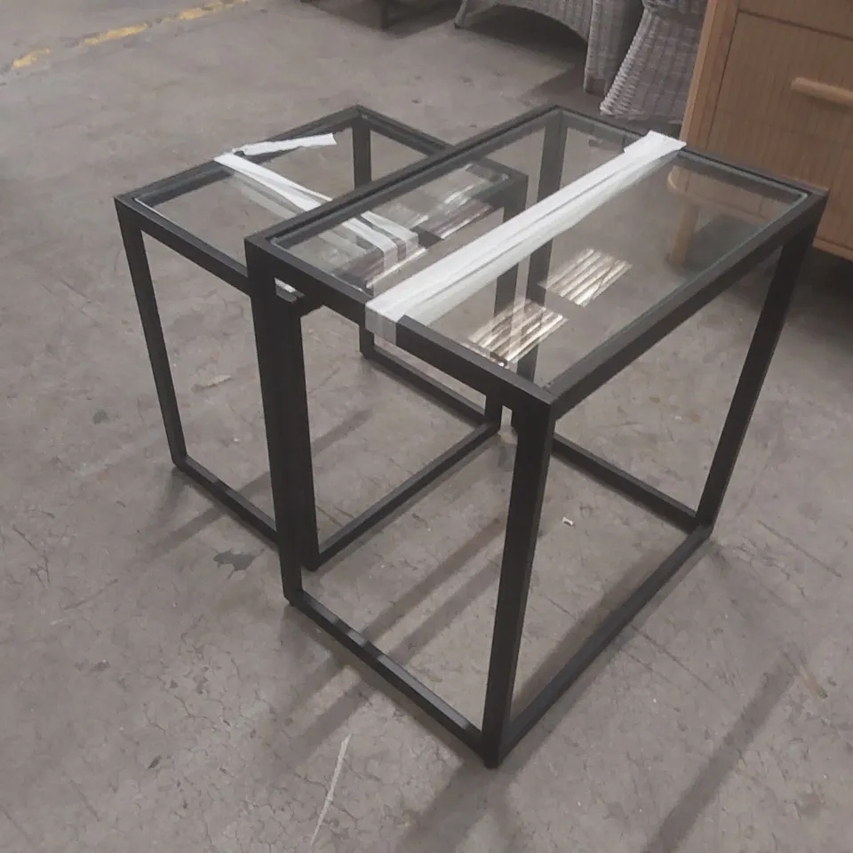 PAIR OF GLASS TOP NESTING TABLES