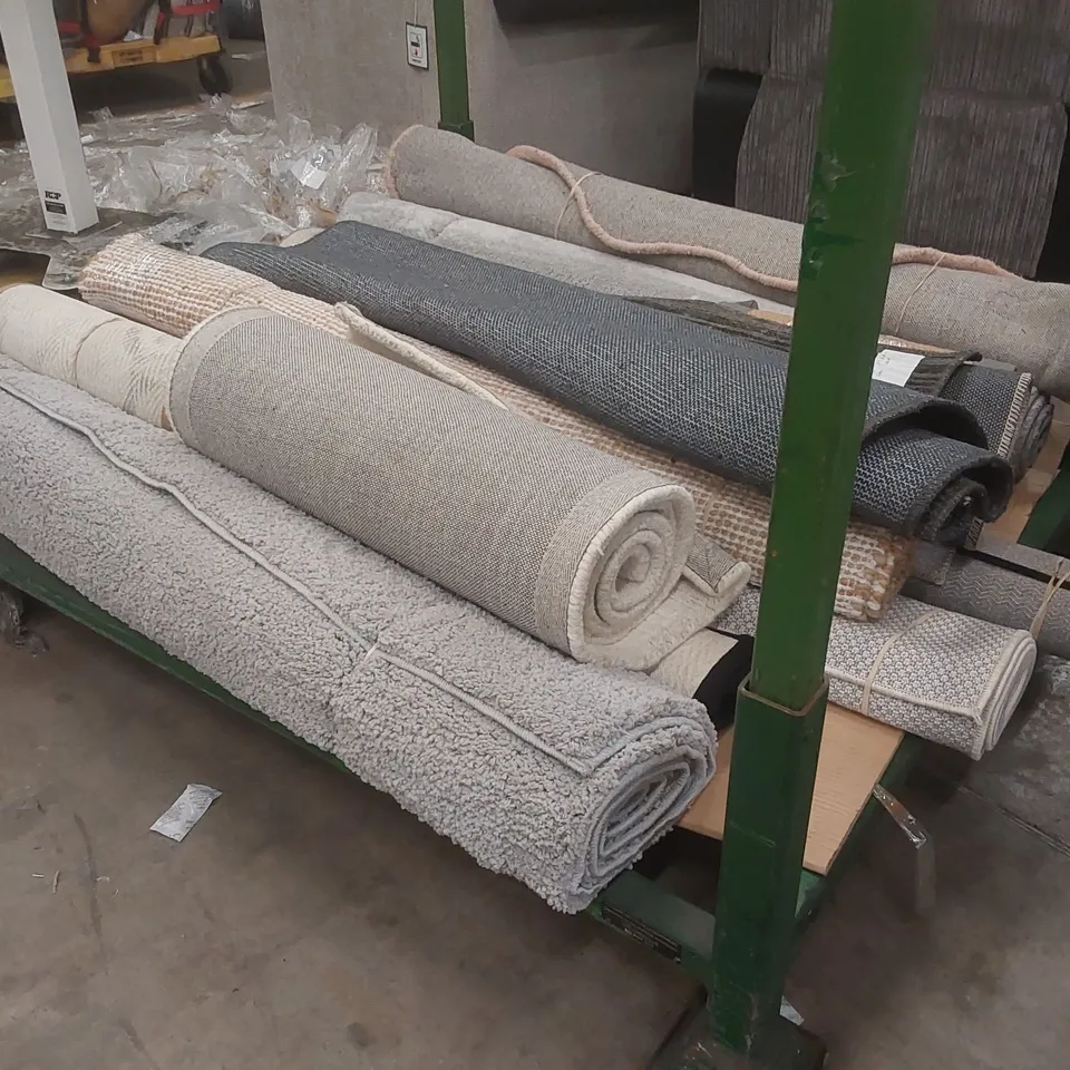 STILLAGE CONTAINING APPROXIMATELY 12x ASSORTED DESIGNER AREA RUGS // STILLAGE NOT INCLUDED