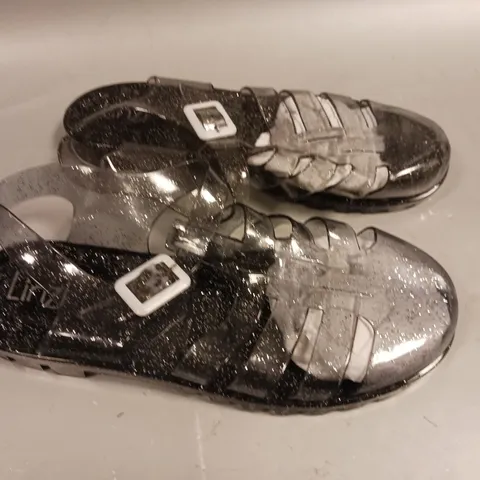 LARGE QUANTITY OF ASSORTED LINZI CLEAR GLITTER PLASTIC SANDALS - VARIOUS SIZES