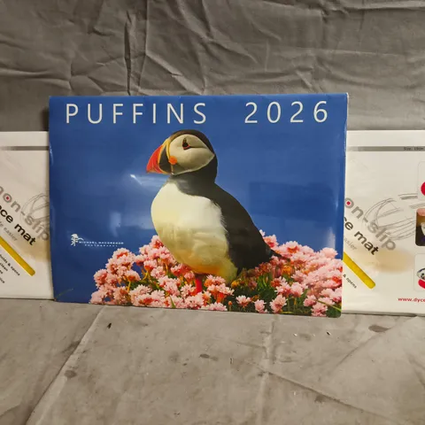BOX OF APPROXIMATELY 20 ASSORTED HOUSEHOLD ITEMS TO INCLUDE PUFFINS 2026 CALENDAR, DYCEM NON-SLIP PLACE MAT, ETC - COLLECTION ONLY