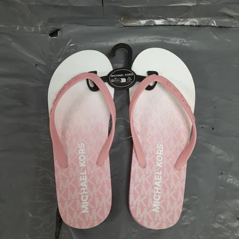 UNBOXED PAIR OF MICHAEL KORS LOGO FLIP FLOP IN PINK US MEANS 8 