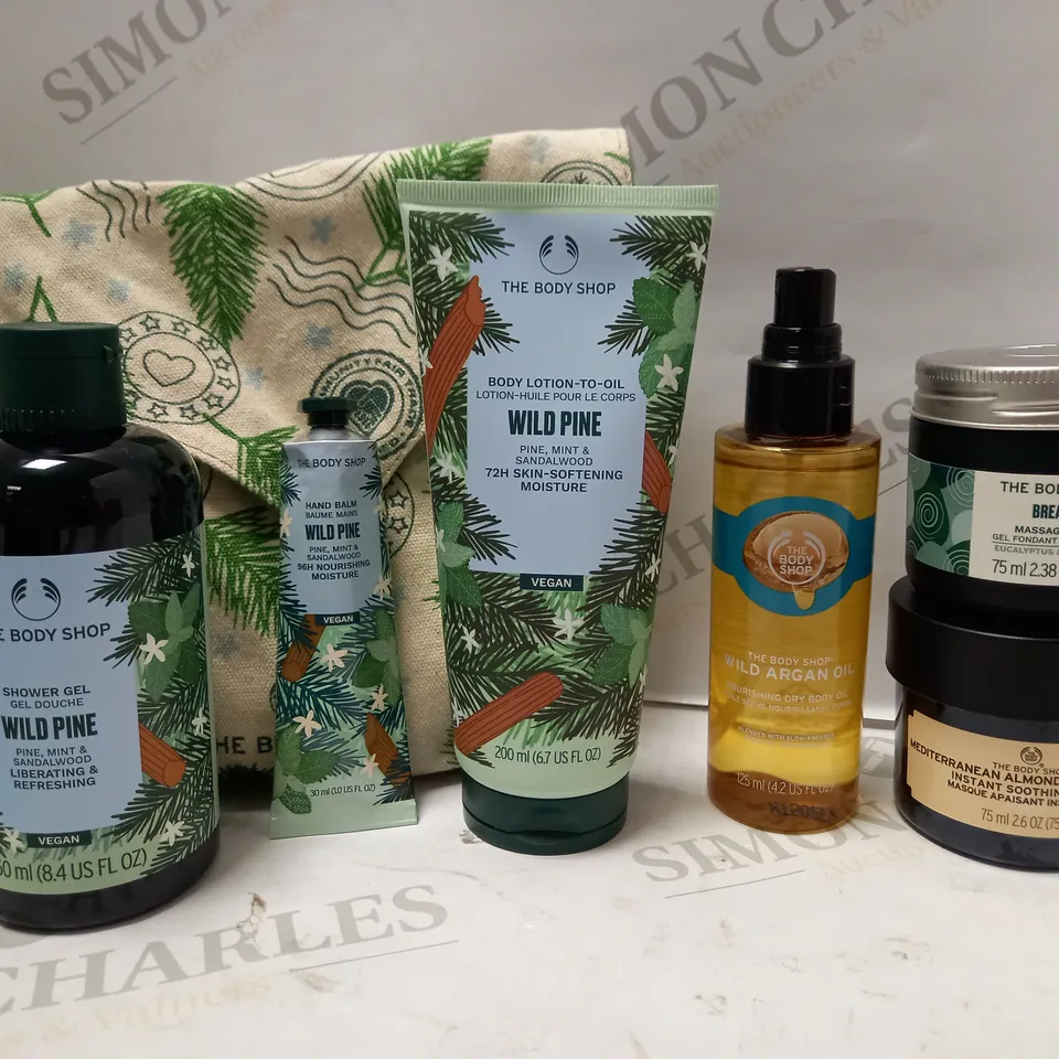 LOT OF 6 ASSORTED THE BODY SHOP PRODUCTS TO INCLUDE WILD ARGAN OIL, BREATHE MASSAGE MELT, WILD PINE HAND BALM, ETC 