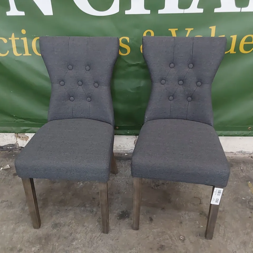 PAIR UPHOLSTERED BUTTONED BACK DINING CHAIRS CHARCOAL FABRIC ON SILVERED LEGS 