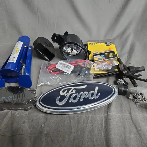 APPROXIMATELY 10 ASSORTED VEHICLE PARTS TO INCLUDE CAR BADGES, BRAKE PADS AND BRAKE PAD