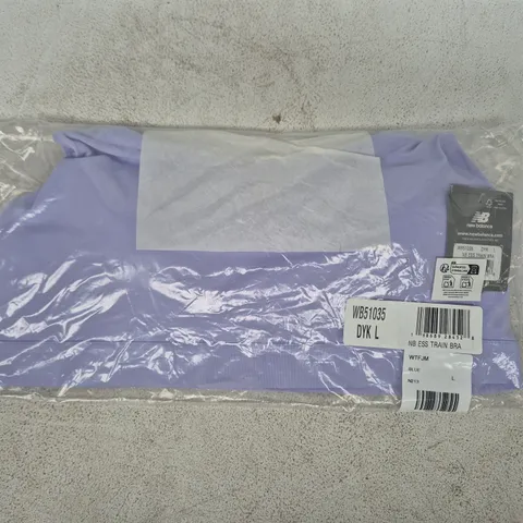 BAGGED NEW BALANCE ESSENTIALS TRAIN BRA IN LILAC SIZE LARGE