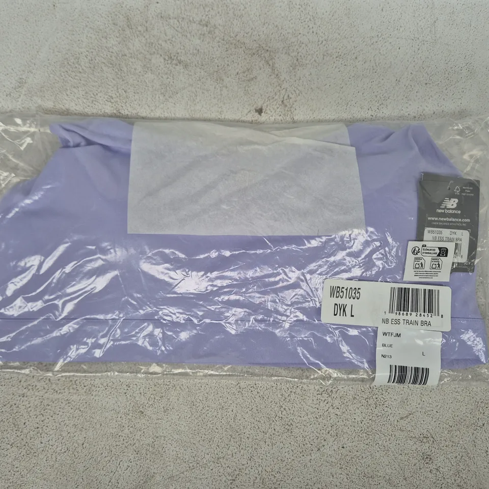 BAGGED NEW BALANCE ESSENTIALS TRAIN BRA IN LILAC SIZE LARGE