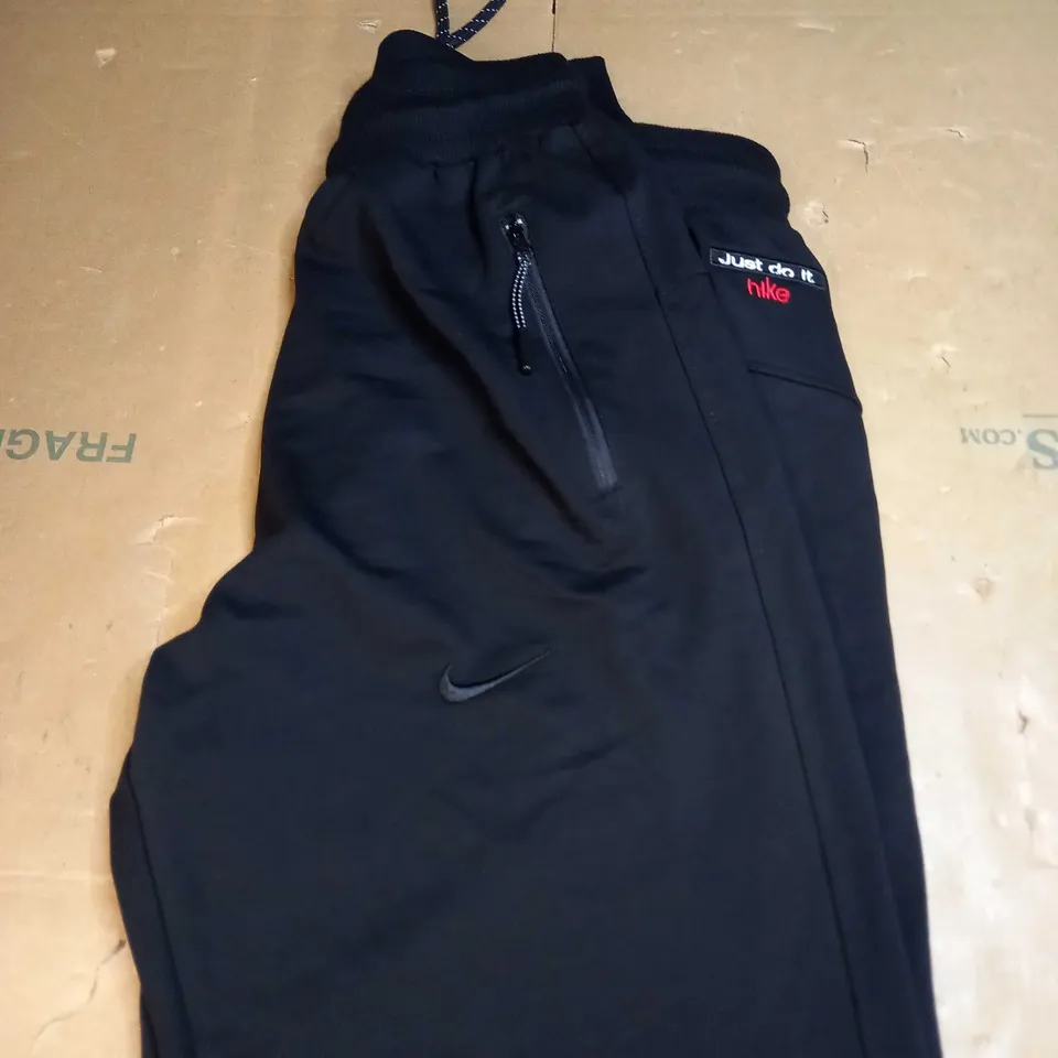 NIKE JUST DO IT TRACKSUIT BOTTOMS SIZE M