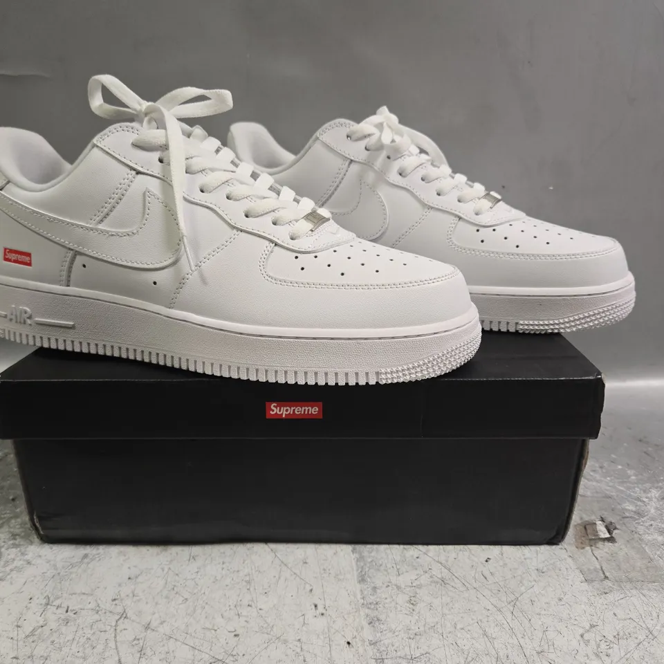 BOXED PAIR OF NIKE AIR FORCE 1 LOW SUPREME SHOES IN WHITE SIZE UK 11