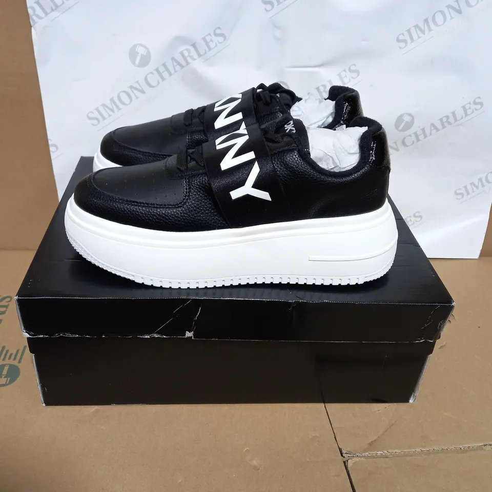 BOXED PAIR OF DKNY MADIGAN SLIP ON TRAINERS SIZE 6