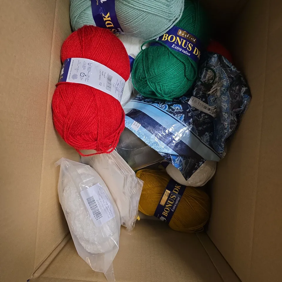 APPROXIMATELY 10 ASSORTED HOUSEHOLD ITEMS TO INCLUDE - CROCHET SUNFLOWERS - DK YARN - FABRIC - ETC