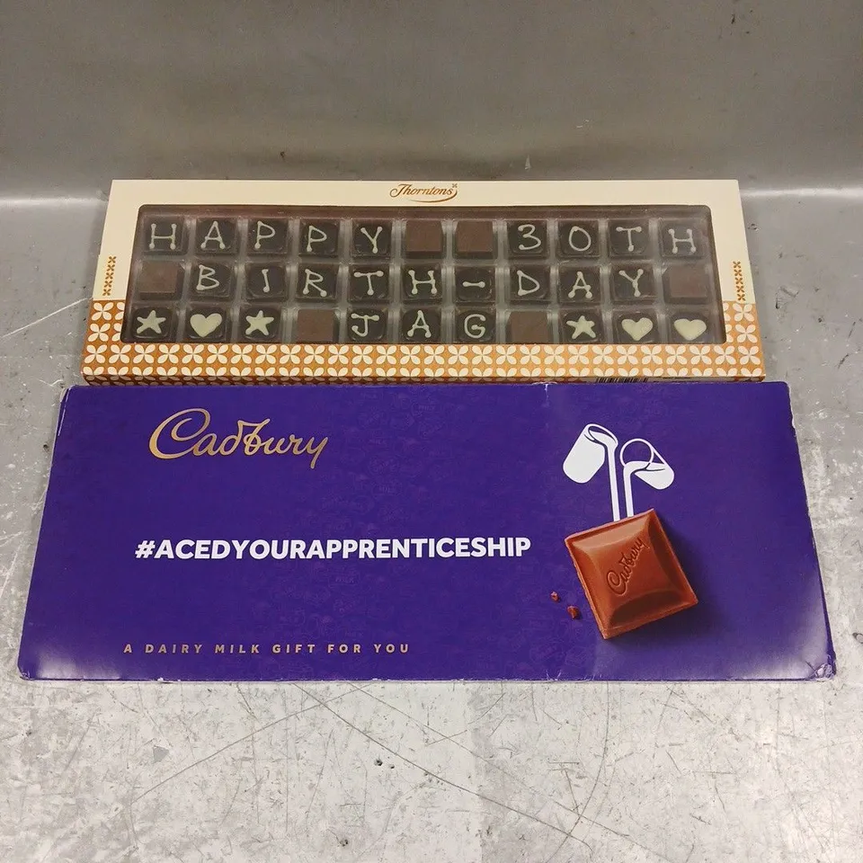 LOT OF 2 ASSORTED FOOD ITEMS TO INCLUDE - THORTONS HAPPY BIRTHDAY CHOCOLATE - CADBURY DAIRY MILK CHOCOLATE GIFT