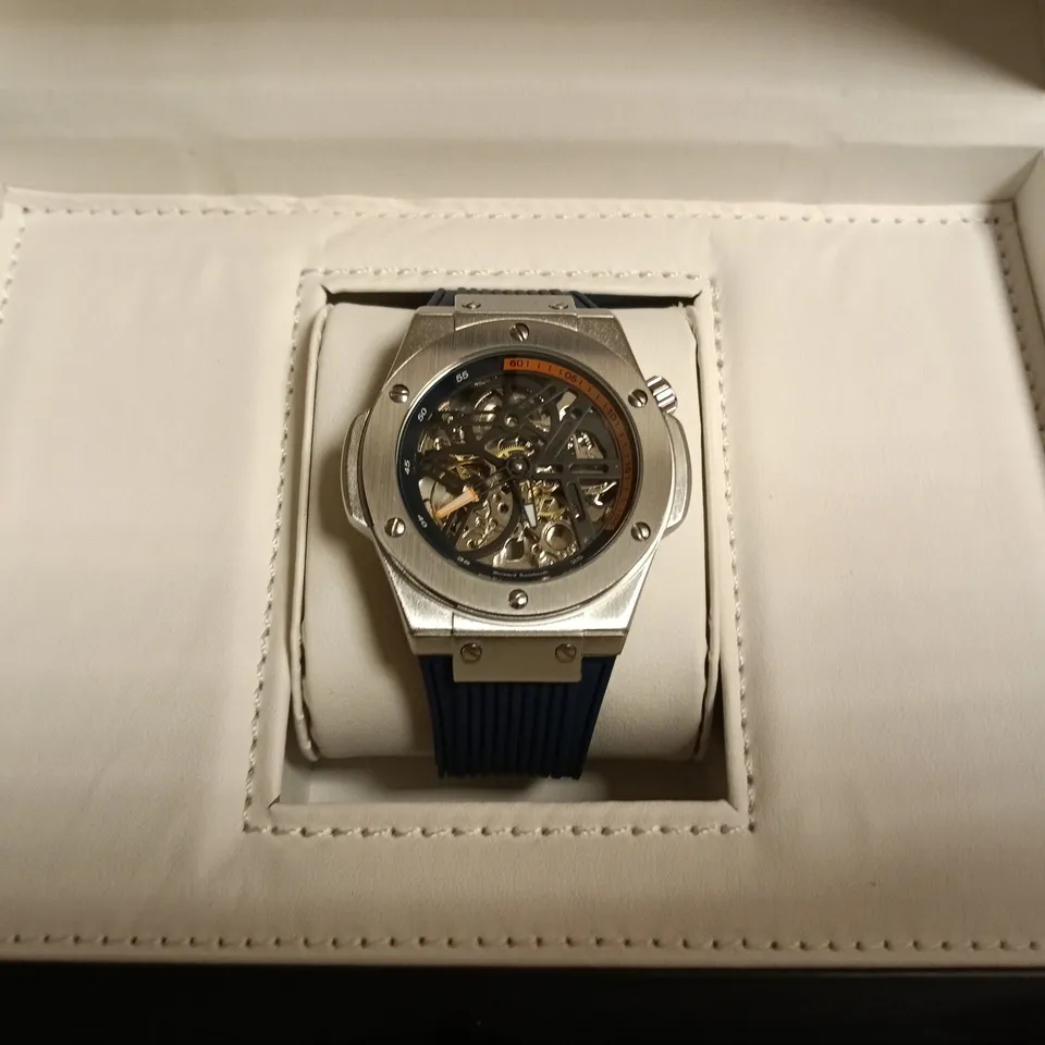 BOXED BERNARD REINHARDT SKELETON WATCH – STAINLESS STEEL CASE, BLUE RUBBER STRAP