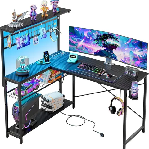 BOXED BESTIER L-SHAPED GAMING DESK WITH POWER OUTLETS - BLACK (1 BOX)