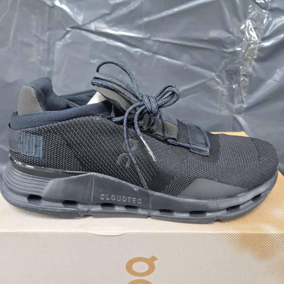 BOXED PAIR OF ON CLOUDNOVA TRAINERS IN BLACK ECLIPSE - UK 8