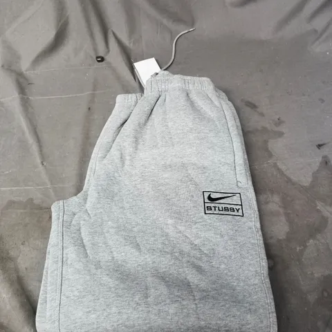 NIKE STUSSY FLEECED TRACKSUIT BOTTOMS - SIZE XS