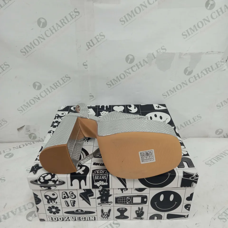 BOXED PAIR OF KOI FOOTWEAR STRAPPY PLATFORM HEELS IN SILVER - SIZE 8