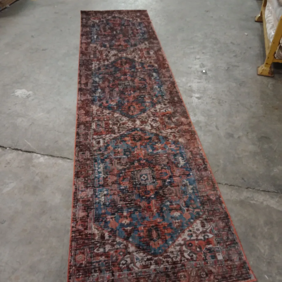CAGE OF APPROXIMATELY 25 DESIGNER RUGS