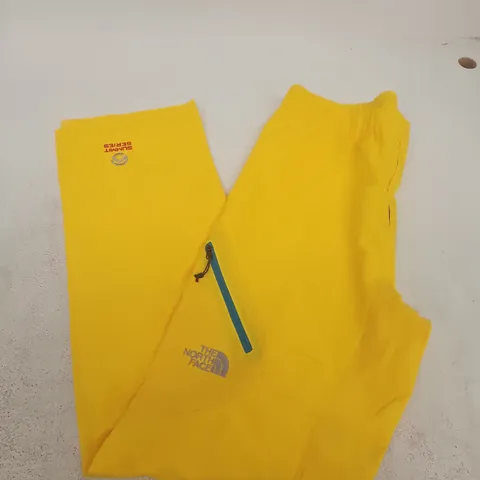 THE NORTH FACE SUMMIT SERIES TRACKSUIT PANTS – YELLOW - SMALL