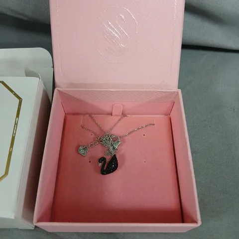 SWAROVSKI SWAN PENDANT NECKLACE WITH HEART CHARMS IN PINK PRESENTATION BOX
