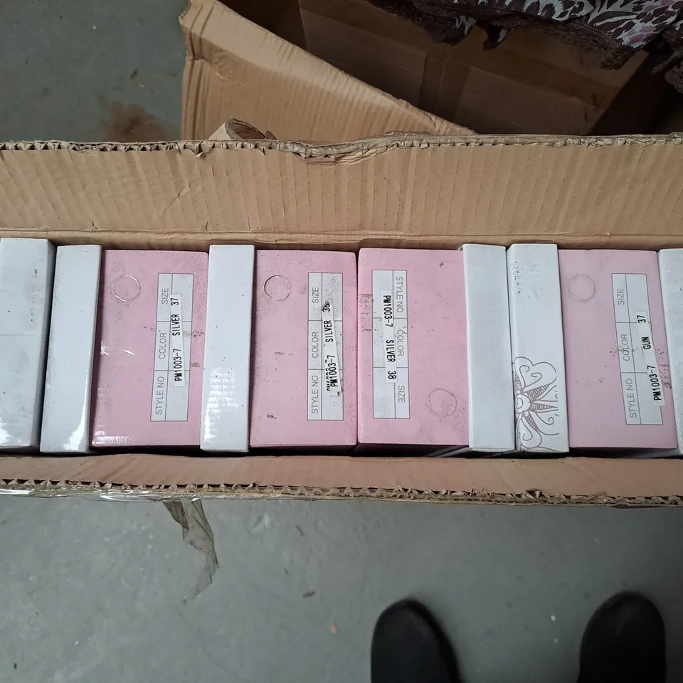 BOXED LOT OF 12 PAIRS OF LADIES APPLE SILVER PUMPS. VARIOUS SIZES