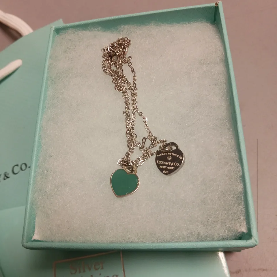 TIFFANY&CO NECKLACE IN SILVER AND TEAL HEART DESIGN INCLUDES BOX, POUCH, POLISHING CLOTH AND GIFT BAG