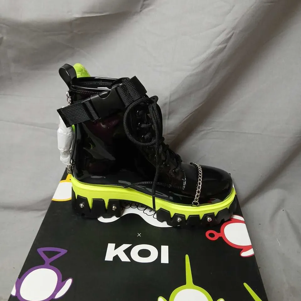 TELETUBBIES X KOI TUBBYTRONIC DIPSY BOOTS – BLACK PATENT BOOTS WITH NEON LIME SOLE, UK4