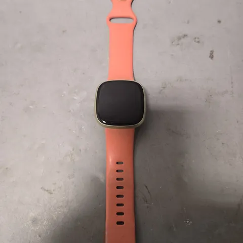 UNBOXED FITBIT IN SILVER WITH PINK RUBBER STRAP - MODEL UNSPECIFIED 