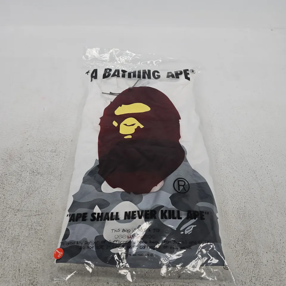 A BATHING APE T-SHIRT – WHITE, CAMOUFLAGE APE LOGO, SIZE L (UK)
