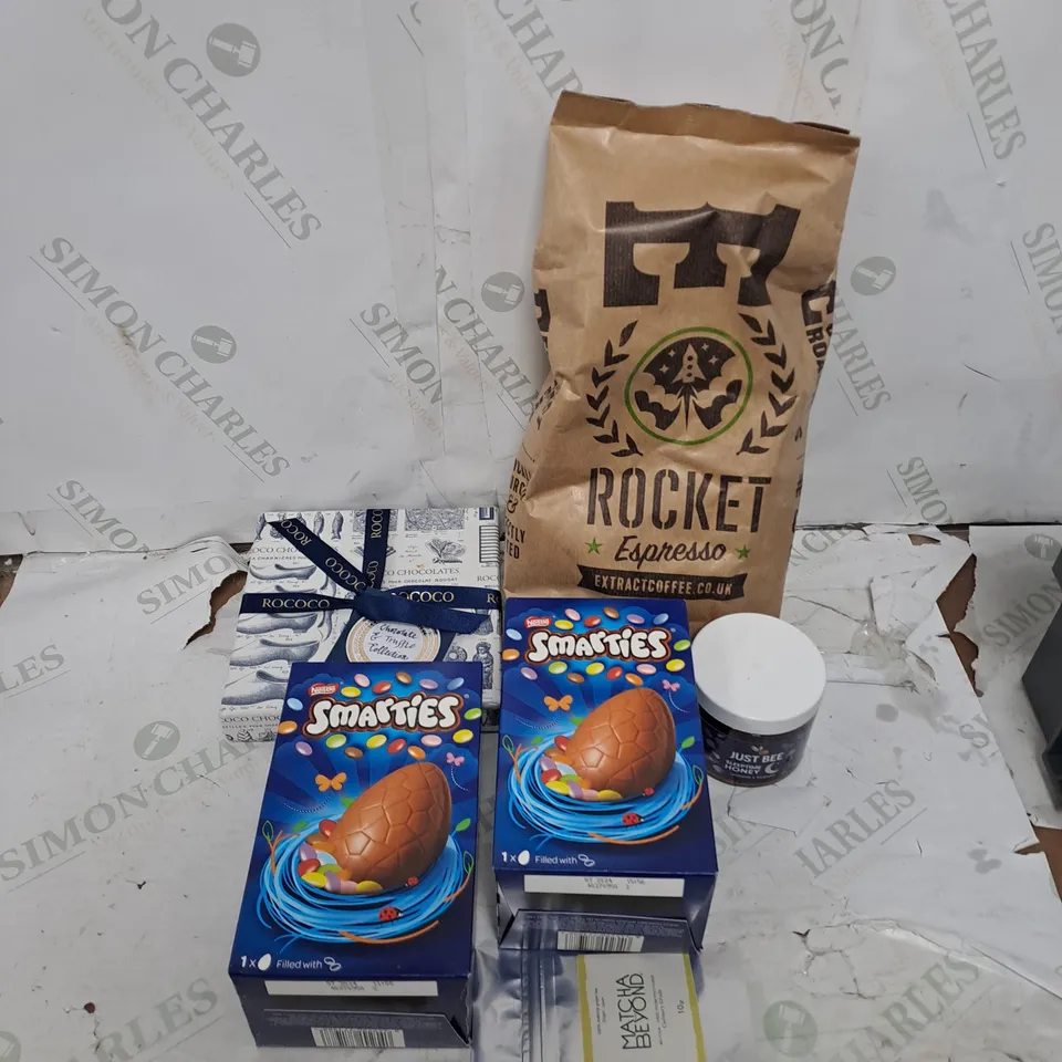 TOTE OF ASSORTED FOOD AND DRINK TOO INCLUDE SMARTIES EASTER EGGS , COFFEE, ROCOCO CHOCOLATE 