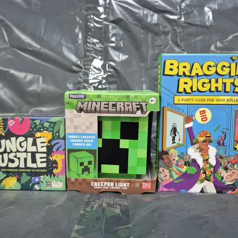 APPROXIMATELY 20 ASSORTED TOYS AND GAMES TO INCLUDE BRAGGING RIGHTS, JUNGLE HUSTLE, MINECRAFT CREEPER LIGHT, ETC - COLLECTION ONLY