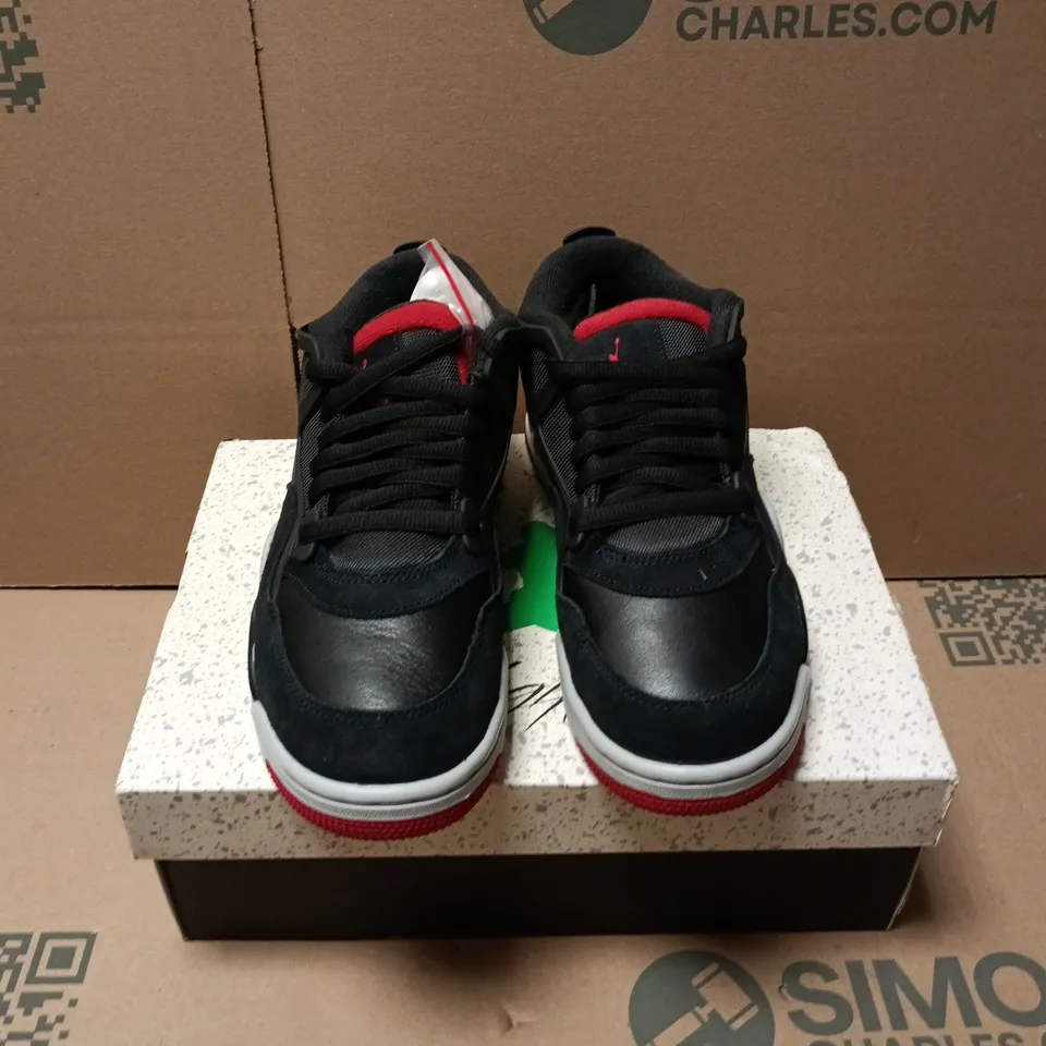 BOXED PAIR OF NIKE AIR JORDAN 4 RM TRAINERS IN BLACK - UK 7