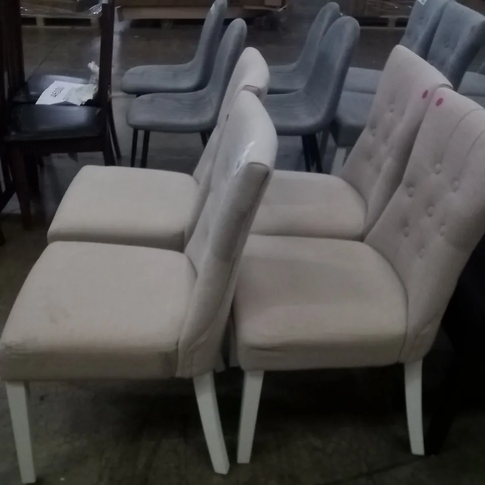 APPROXIMATELY 4 BEIGE FABRIC BUTTON BACK DINING CHAIRS WITH WHITE LEGS