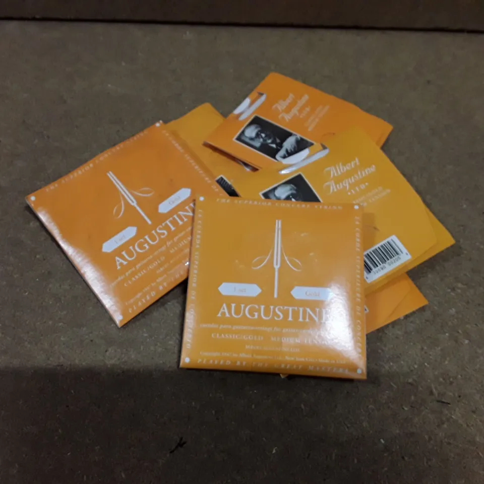 LOT TO CONTAIN APPROXIMATELY 40 ALBERT AUGUSTINE GOLD MEDIUM TENSION GUITAR STRINGS 