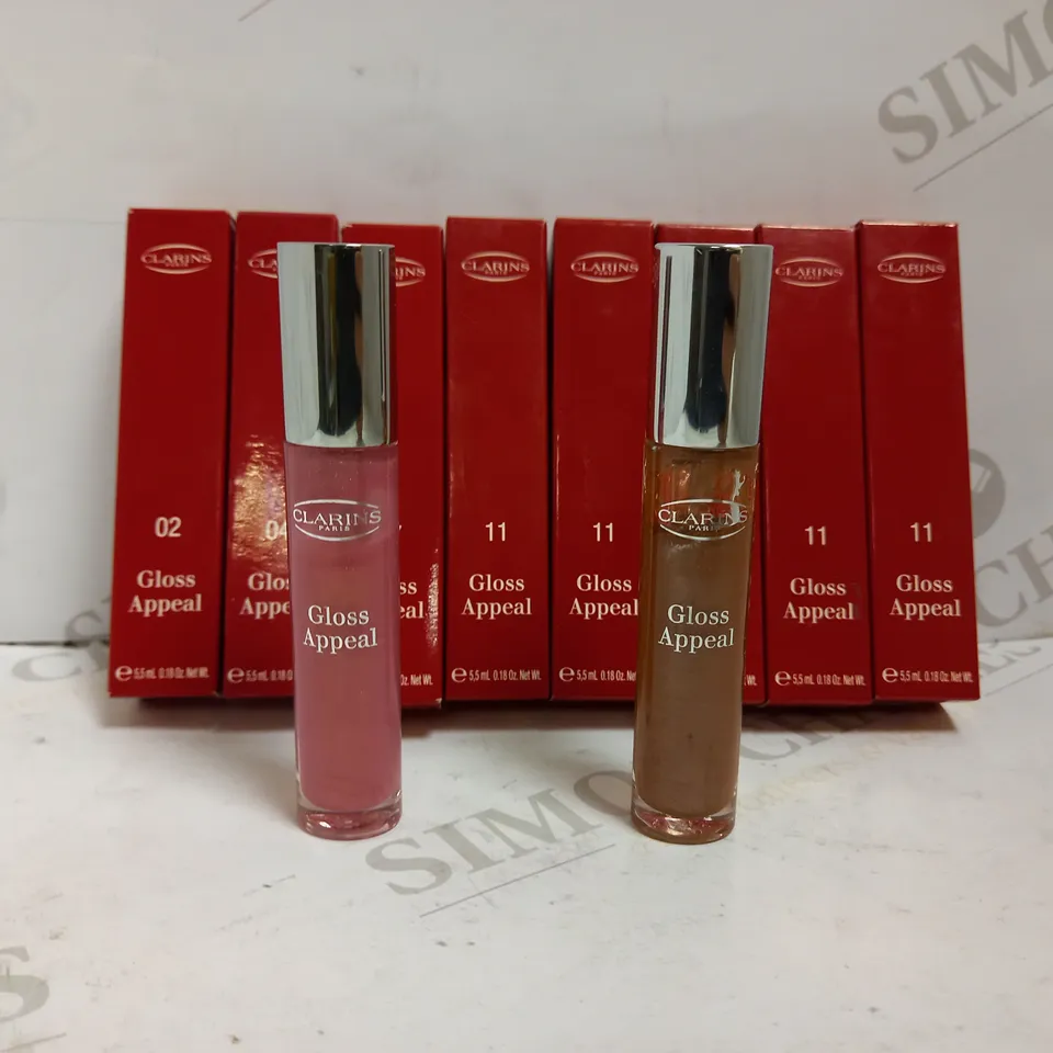 LOT OF 8 CLARINS LIP GLOSS IN ASSORTED COLOURS